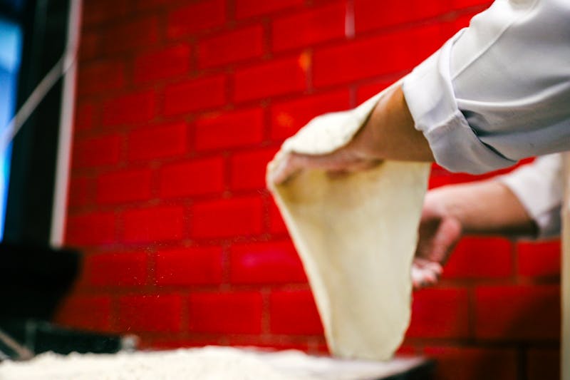 Marcos marco's pizza team working in kitchen Buffalo NY